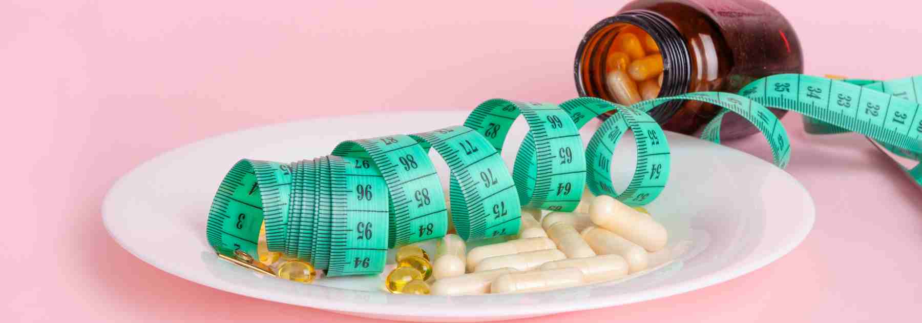 Balancing Orlistat tablets and a healthy diet. 
